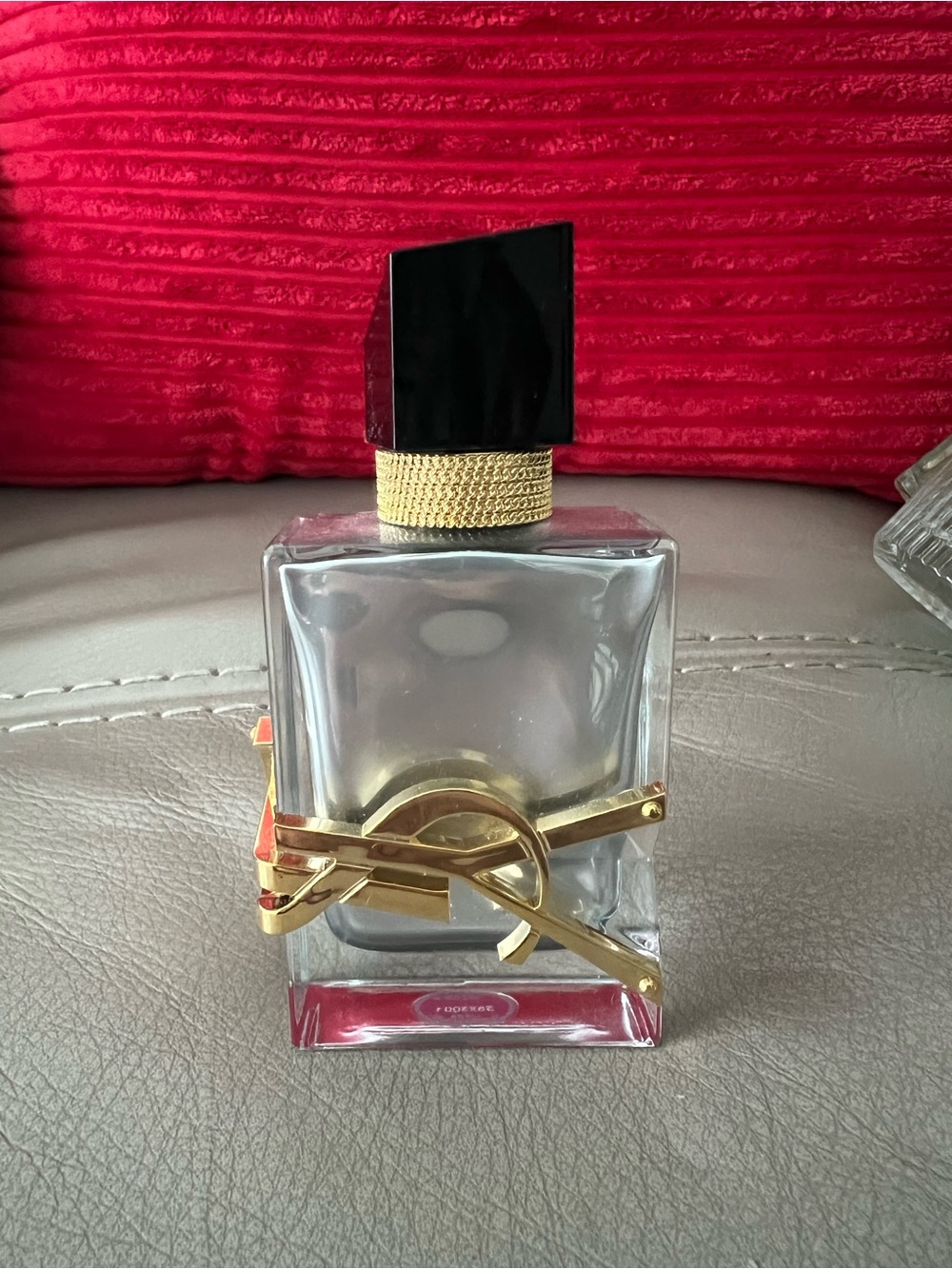 Saint Laurent Clear Glass Perfume Bottle with Gold Hardware and Black Cap